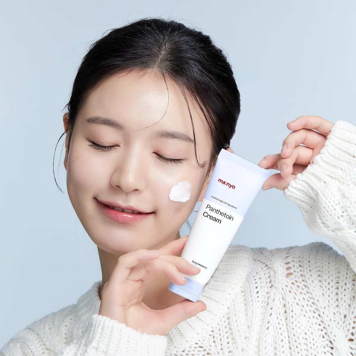 Panthetoin Cream squeeze tube with a visible cream swatch on skin