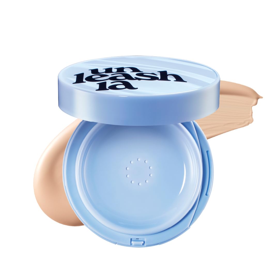 Blue cushion compact with puff resting inside the open powder compartment