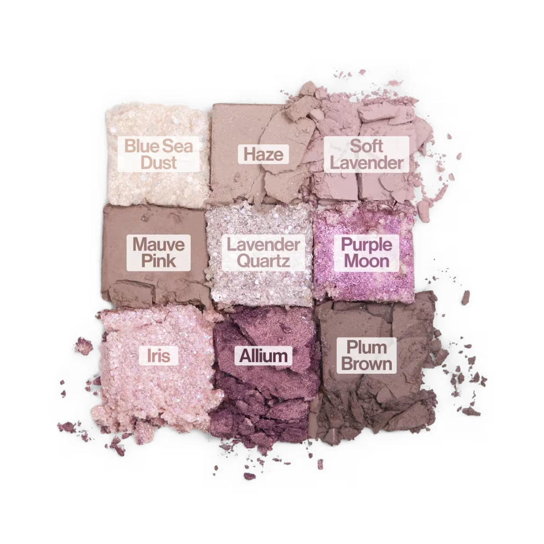 Nine pressed eyeshadow shades in mauve, lavender, purple, and deep plum with glitter fallout