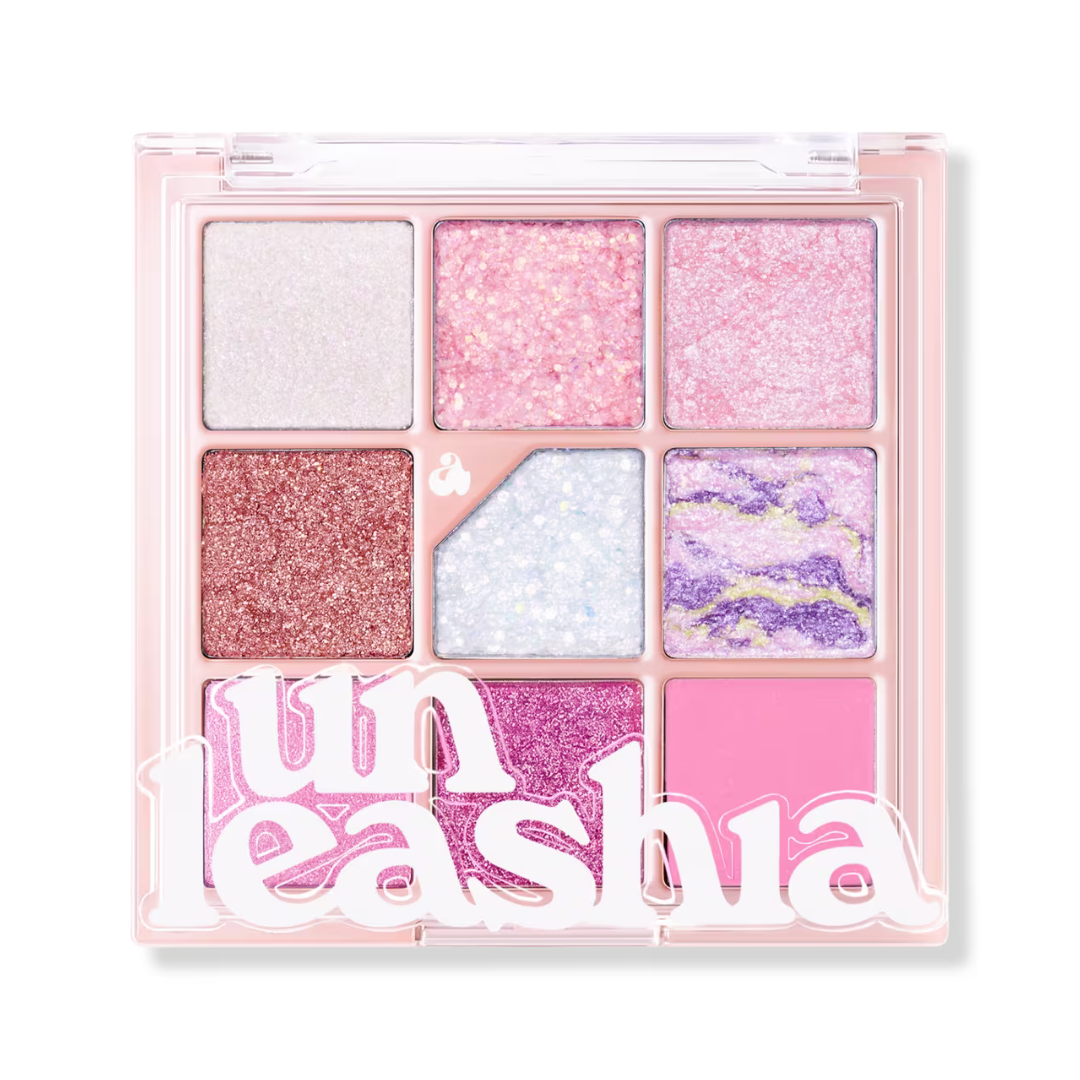 Eyeshadow palette with square pink and rose glitter shades in clear compact