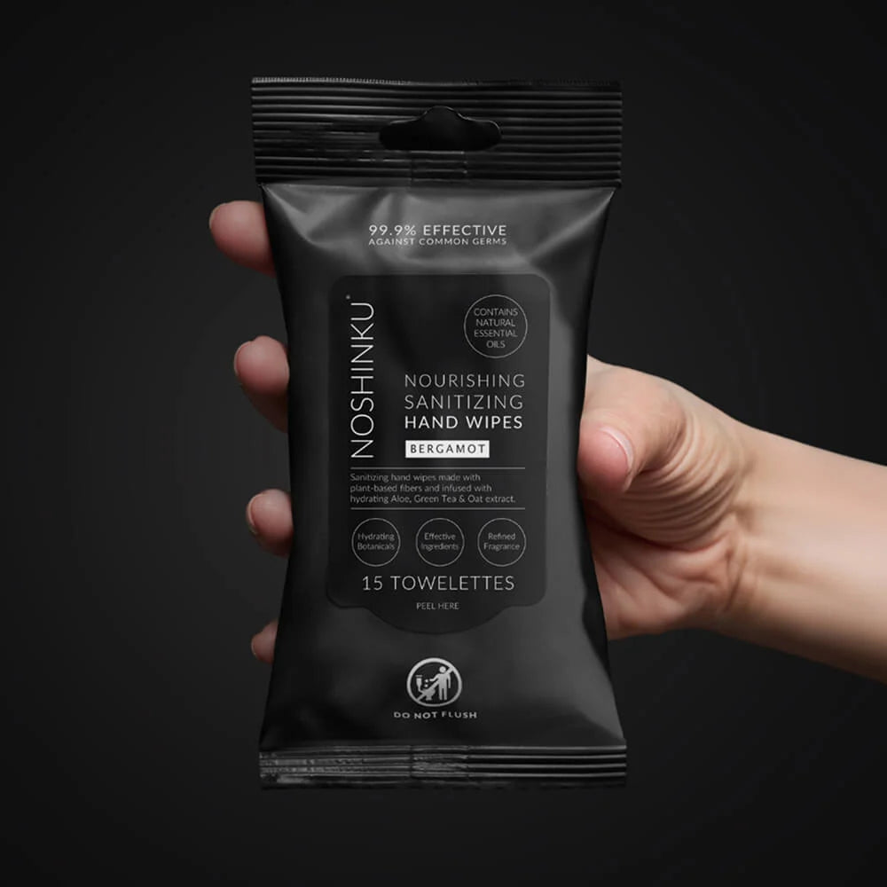 a hand holding a black package