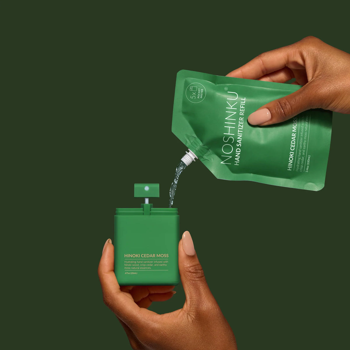 a hand pouring a green container into a small container