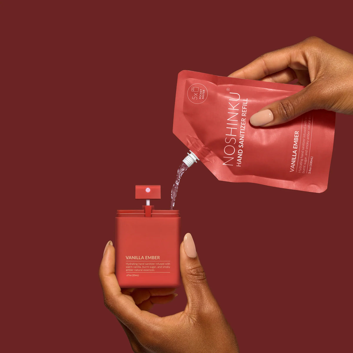 a hand pouring a red container into a red container