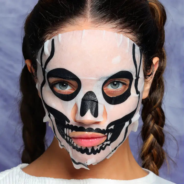 Skull-pattern Halloween face mask covering skin with painted eyes and lips