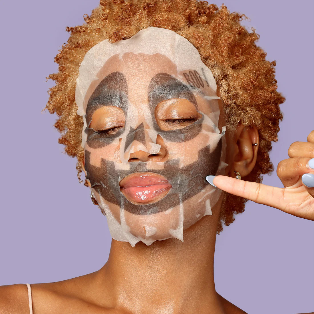 Halloween character face mask on skin with black-and-white skull pattern
