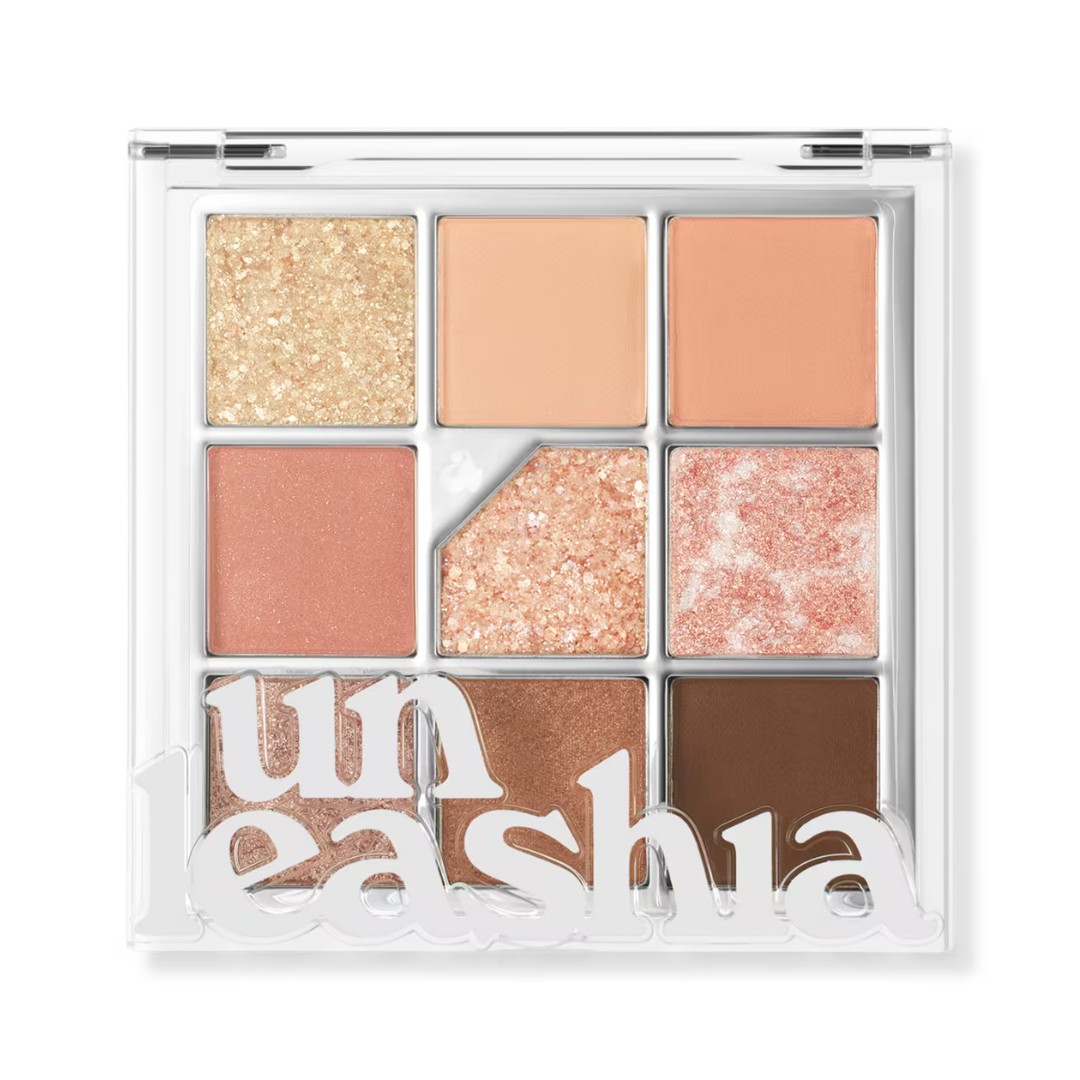 Nine-pan glitter eye palette with champagne, peach nude, terracotta, pink, and brown shades