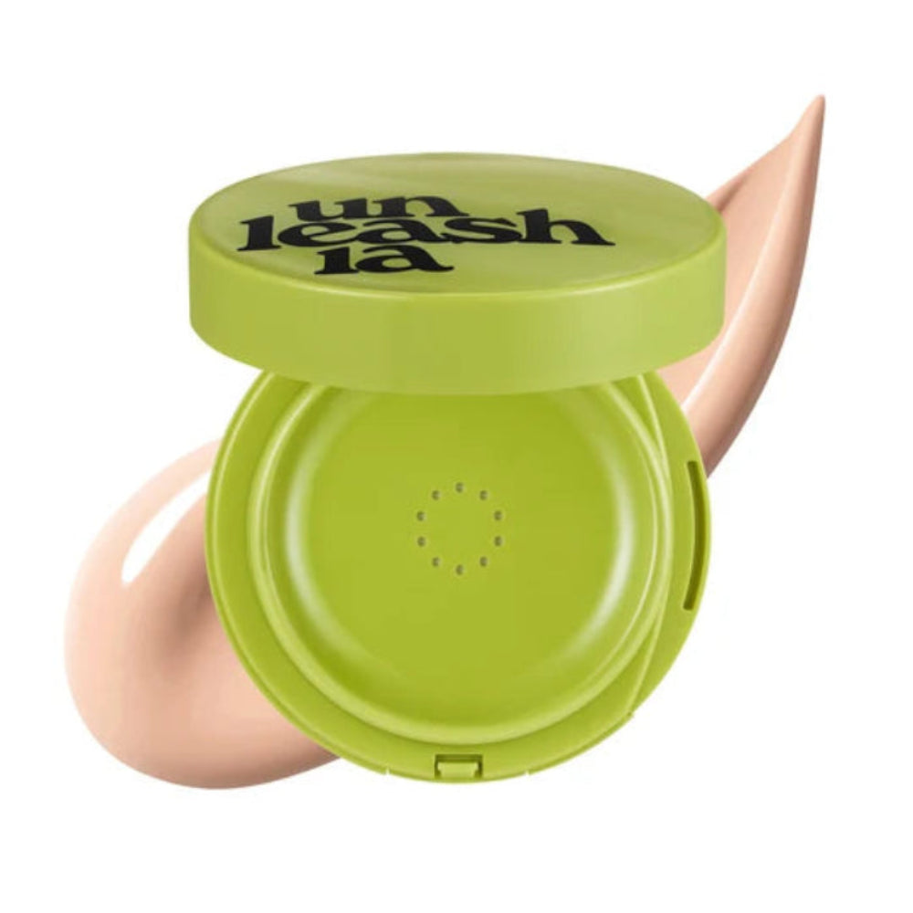 Healthy green satin cushion compact, front view with applicator resting at side