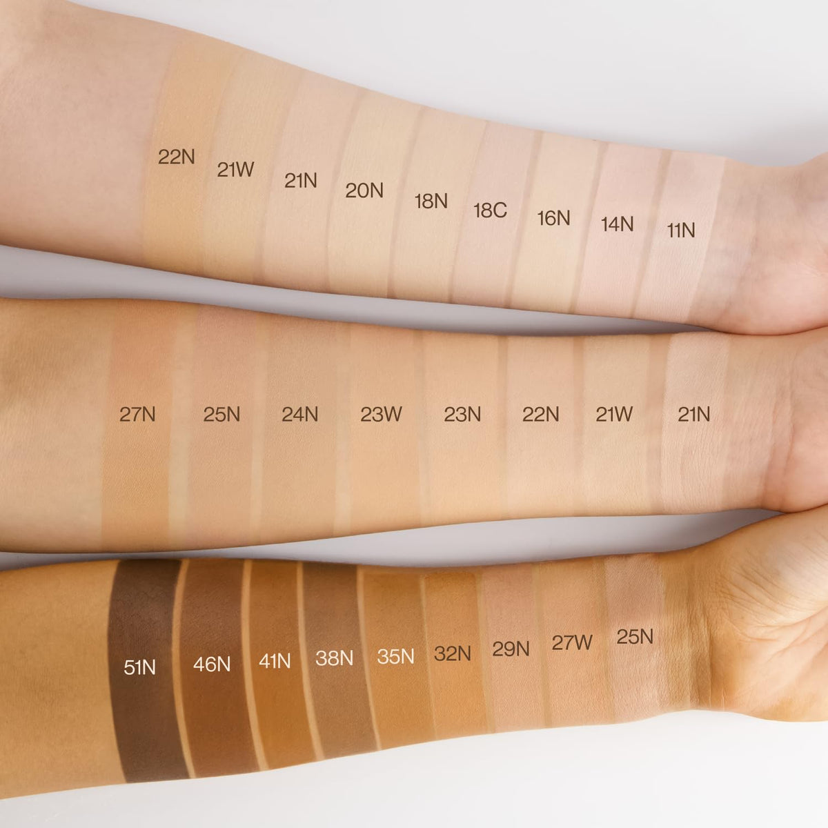 Forearm cushion makeup shade swatches in multiple tones, labeled along the arm